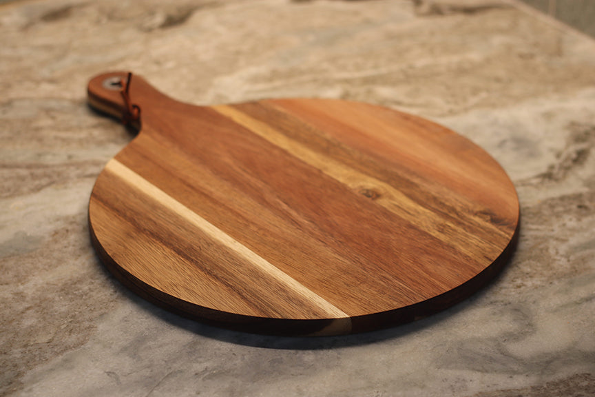 custom laser engraved wood cutting board | initials monogram name brand logo engraved cutting board | Shop handmade apparel, homewares, gifts, & more at The Branded Iron. Or, contact us today for all your small business customization needs: tees, hats, cups, & more...we do it all. Proudly located in Boerne, Texas.