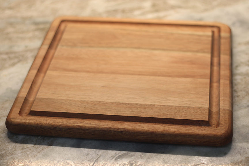 custom laser engraved wood cutting board | initials monogram name brand logo engraved cutting board | Shop handmade apparel, homewares, gifts, & more at The Branded Iron. Or, contact us today for all your small business customization needs: tees, hats, cups, & more...we do it all. Proudly located in Boerne, Texas.