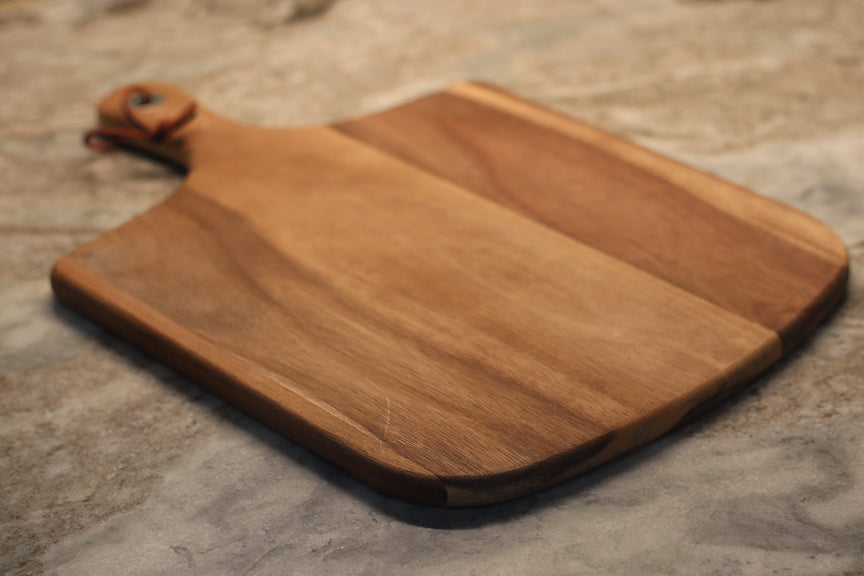 custom laser engraved wood cutting board | initials monogram name brand logo engraved cutting board | Shop handmade apparel, homewares, gifts, & more at The Branded Iron. Or, contact us today for all your small business customization needs: tees, hats, cups, & more...we do it all. Proudly located in Boerne, Texas.
