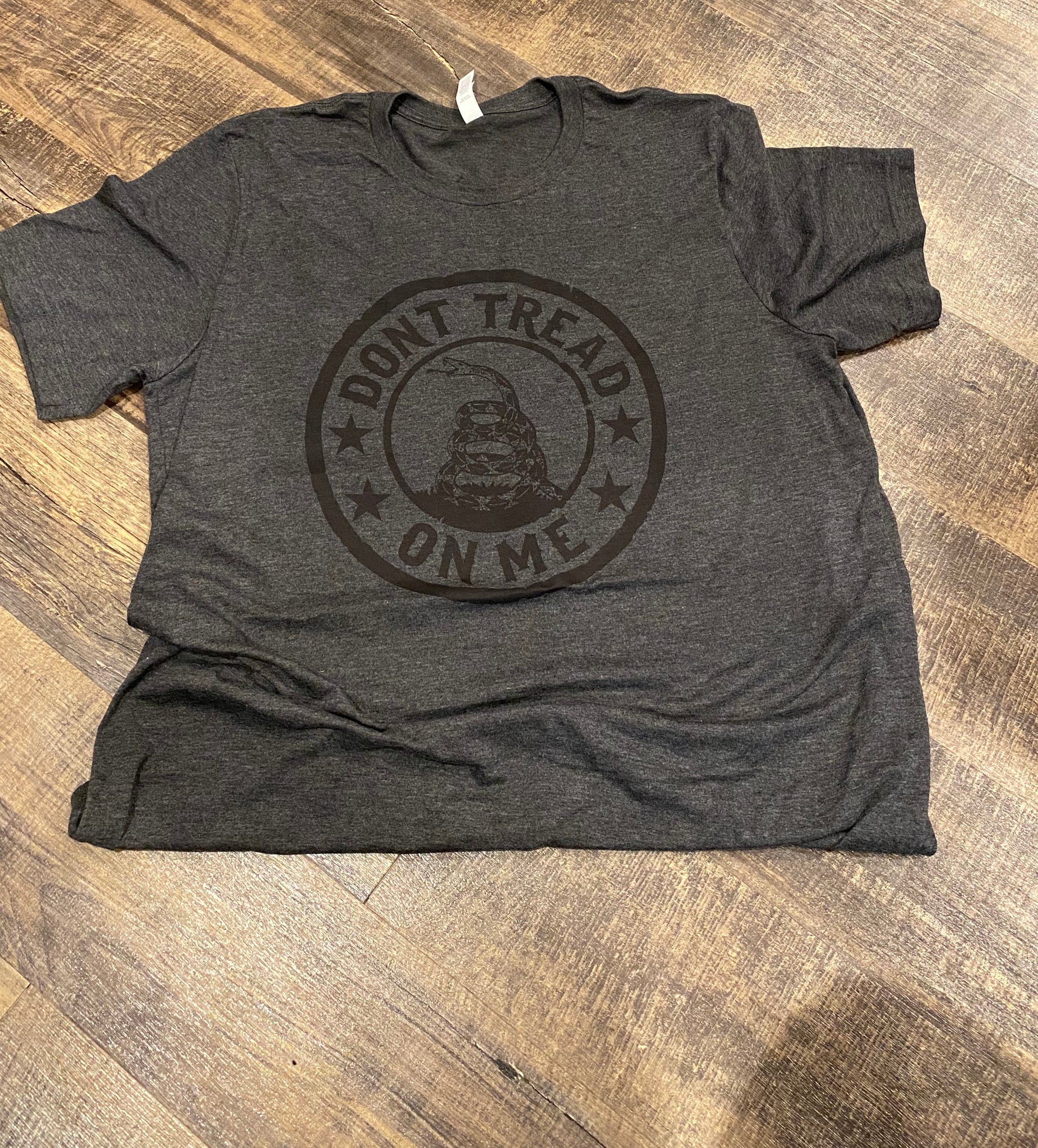 Gadsden flag don't tread on me screen printed tee shirt | Shop handmade apparel, homewares, gifts, & more at The Branded Iron. Or, contact us today for all your small business customization needs: tees, hats, cups, & more...we do it all. Proudly located in Boerne, Texas.